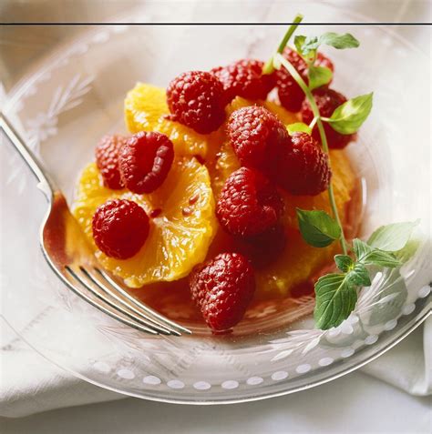 Raspberry and Orange Fruit Salad in a … – License Images – 657997 StockFood