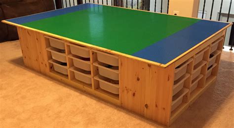 The Lego table goes awesome! Uses 4 IKEA's TROFAST frames. 4 feet x 6 feet table top. Legos are ...