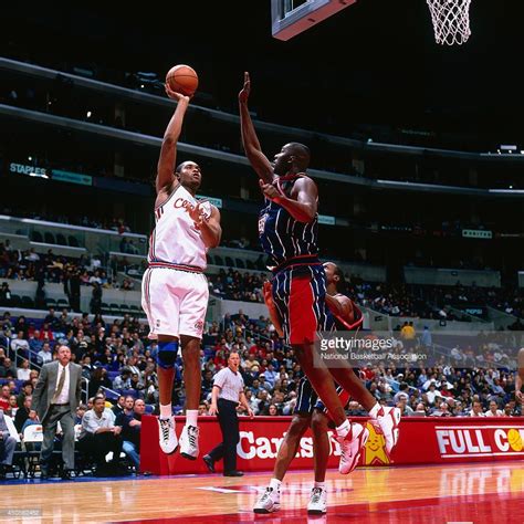 Michael Olowokandi of the Los Angeles Clippers shoots against the ...