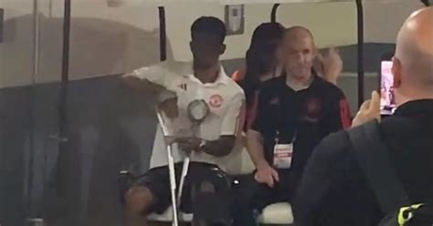 Man Utd star spotted leaving MetLife stadium on crutches after Arsenal ...