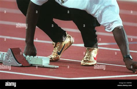 MICHAEL JOHNSON WITH GOLD NIKE SHOES. 01 August 1996 Stock Photo - Alamy