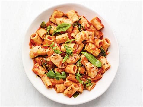 Mezzi Rigatoni with Tomatoes, Scallops and Arugula Recipe | Food Network Kitchen | Food Network