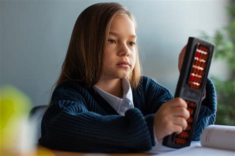 Free Photo | Medium shot girl learning math at school