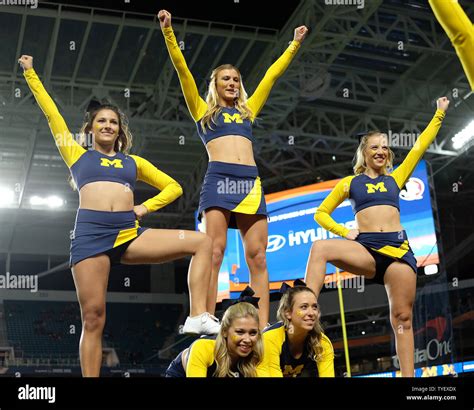 Michigan Wolverines cheerleaders practice their routines prior to the ...