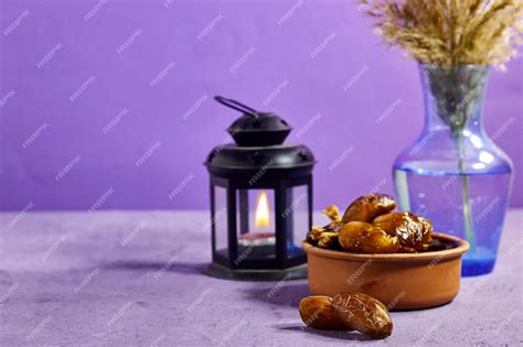 Premium Photo | Pottery bowl of pitted dates with arabic lantern and ...
