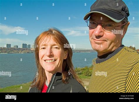 smiling man and woman with Hudson River background Stock Photo - Alamy