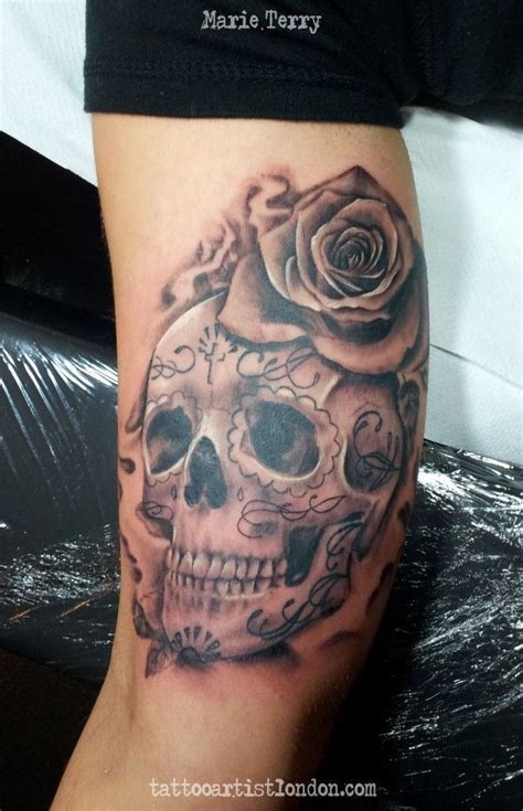 realistic tattoo of a sugar skull with rose. Tattooed in black and ...