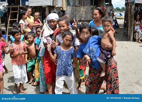 Group Of Indigenous Badjao Children Gather On Sandy Ground Happy Posing ...