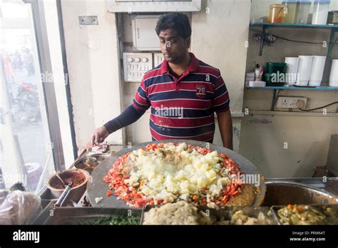 Preparing and selling Indian street food in a food stall. Photographed ...