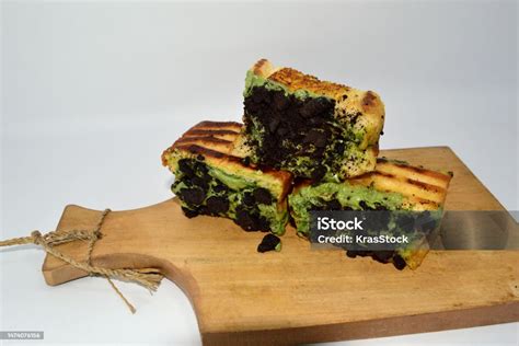 Roti Bakar With Chocolate Biscuit And Matcha Topping Stock Photo ...