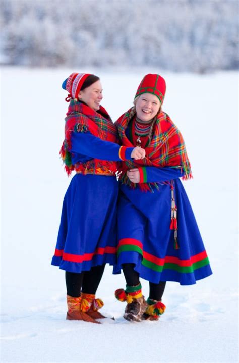 North and south Sami costumes. The woman to the right is wearing a costume from Jämtland and the ...