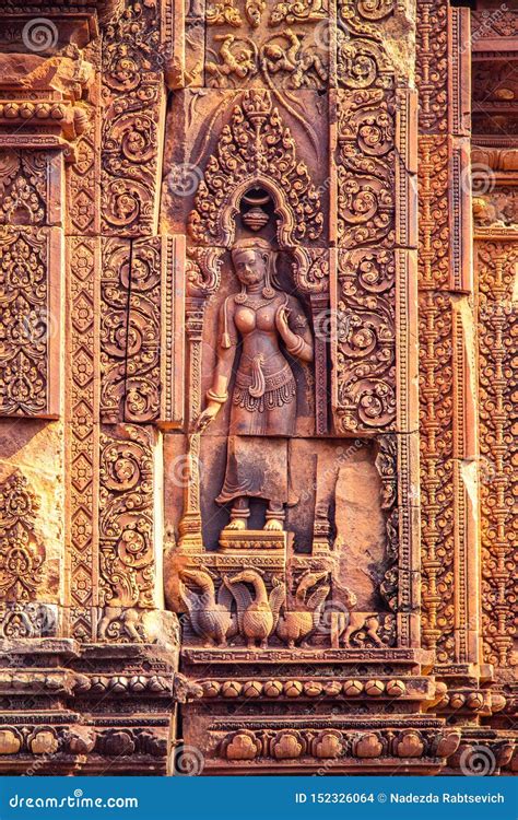 Devata or Goddess Carved into the Red Sandstone Walls, Banteay Srei ...