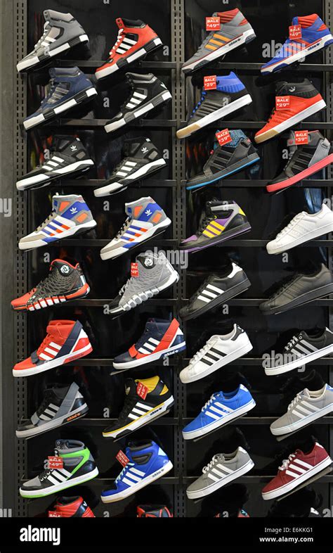 Colorful display of Adidas athletic shoes at Foot locker sporting goods store, on Broadway in ...