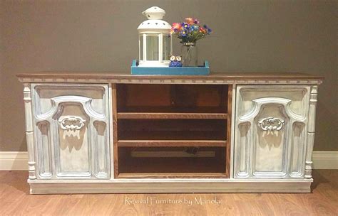 This was an old dresser that we converted into a TV stand, the middle section had three large ...