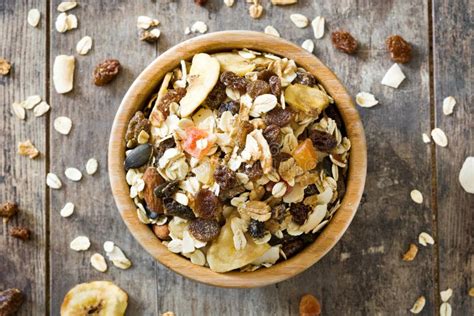 Muesli and Dried Fruit in Wooden Bowl Isolated Stock Image - Image of ...