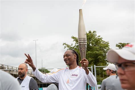 Watch Snoop Dogg Carry the Olympic Torch Through Paris | NBC Insider