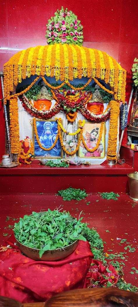 the shrine is decorated with flowers and garlands