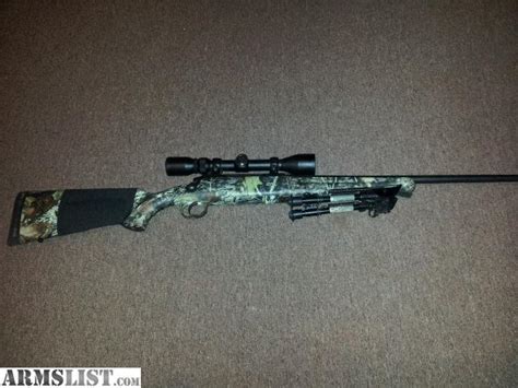 ARMSLIST - For Sale: Camo Savage Axis 223 with ammo.