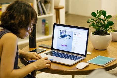 Woman in Black Tank Shirt Facing a Black Laptop Computer on Brown ...