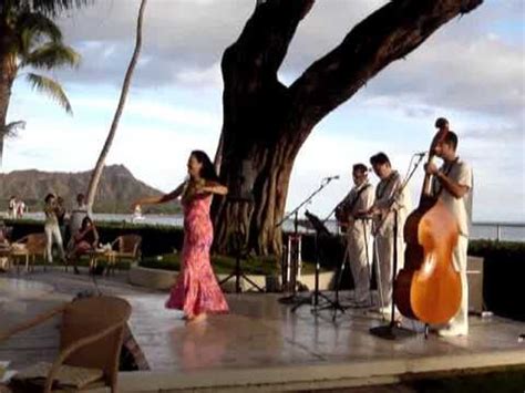 Halekulani Hotel at sunset "House without a key" hula and mai- tai's, overlooking diamond head ...