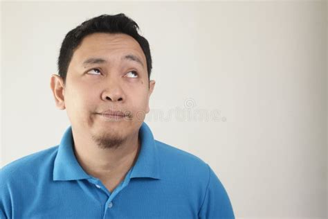 Asian Man Mocking Face Trying Hard Not To Laugh Stock Photo - Image of ...