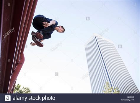 Man jumping over fence in city hi-res stock photography and images - Alamy