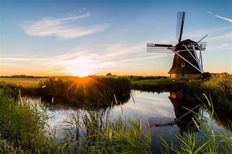 Download Sky Sunrise Building Reflection Man Made Windmill HD Wallpaper