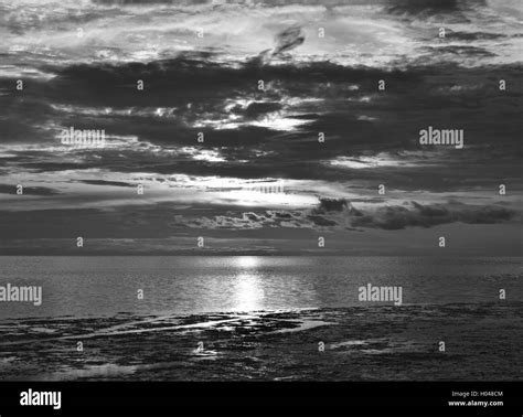 Heavy storm clouds at sunset on a beach in Florida Stock Photo - Alamy