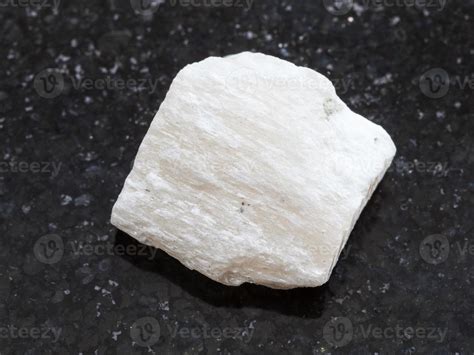 raw Gypsum stone on dark background 13761973 Stock Photo at Vecteezy