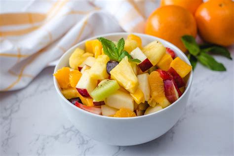 Fruit Salad With Ananas, kiwi, Apples, Strawberries, Orange and Mango ...