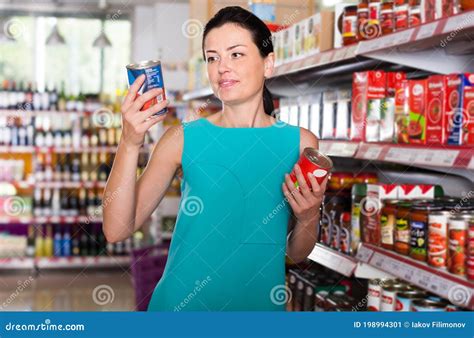 Portrait of Adult Female in the Shop Holding Tomato Paste Stock Image - Image of food ...