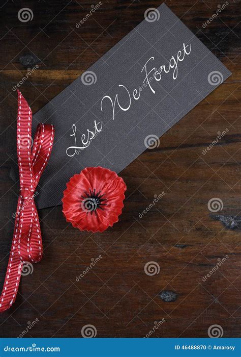 Lest we Forget, Red Poppy Lapel Pin Badge on Dark Recycled Wood - Vertical Stock Photo - Image ...