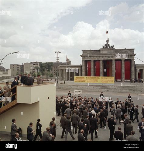 US president John F. Kennedy visits the Berlin Wall and Brandenburg Gate in West Berlin, Germany ...