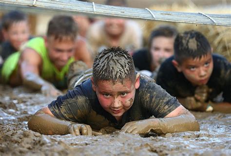 The Mud Run: First-time event at Miami County Fair pits kids against muddy obstacle course ...