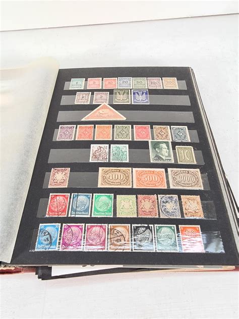 A stamp album containing a collection of various stamps