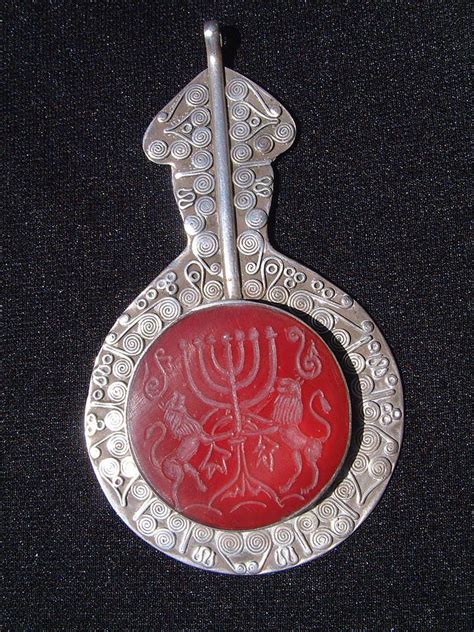 Turkoman silver pendant decorated with carnelian featuring a menorah and the Judean lions. by ...