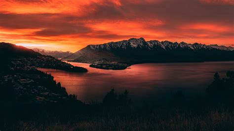 Download New Zealand Orange Mountains Sunset Wallpaper | Wallpapers.com