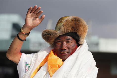 Sherpa guide scales Mount Everest for record 25th time