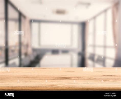 empty wooden desk with office background Stock Photo - Alamy