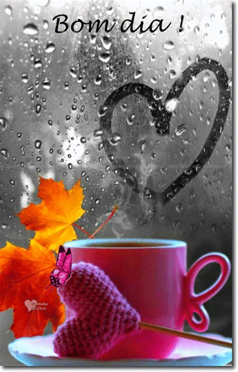 a coffee cup with a knitted heart on it next to an orange maple leaf