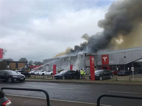 Fire crews battle huge Tesla dealership fire in Crawley - Surrey Live