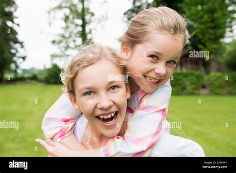 Two sisters hugging, portrait Stock Photo - Alamy