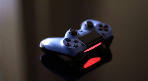 Blue Sony Ps4 Controller on Black Surface · Free Stock Photo