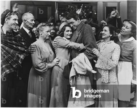 Frank Faylen, H. B. Warner, Beulah Bondi, Donna Reed, James Stewart, Lillian Randolph, on-set of ...