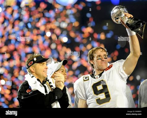 Drew Brees #9 of the New Orleans Saints holds up the Vince Lombardi ...