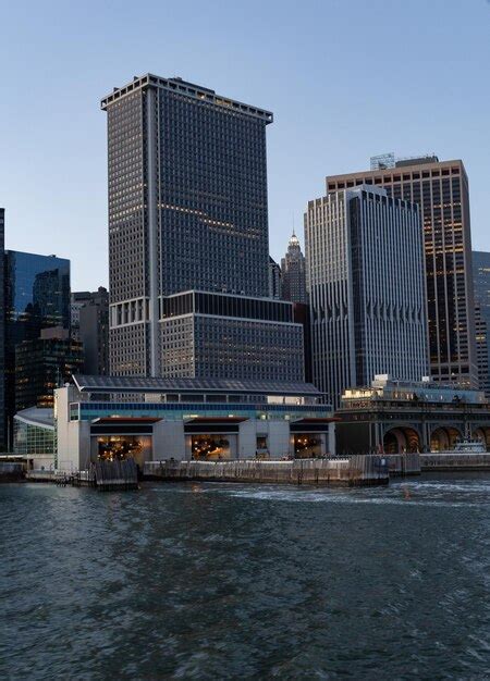 Premium Photo | Lower manhattan skyline at sunset viewed from the water