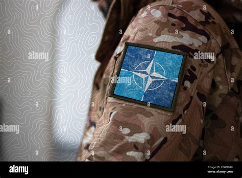 NATO Soldier. Soldier with flag NATO, NATO flag on a military uniform ...