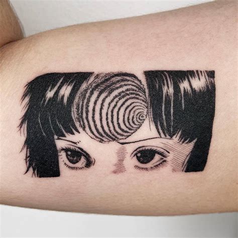 Uzumaki tattoo located on the inner arm.