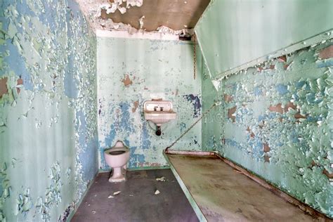 Inside a Jail Cell with a Metal Bed Stock Photo - Image of weathered, toilet: 39731468