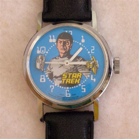 A vintage wind-up Star Trek wristwatch by Bradley Time. It features Spock with the Enterprise ...